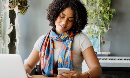 young-woman-checking-her-phone-min